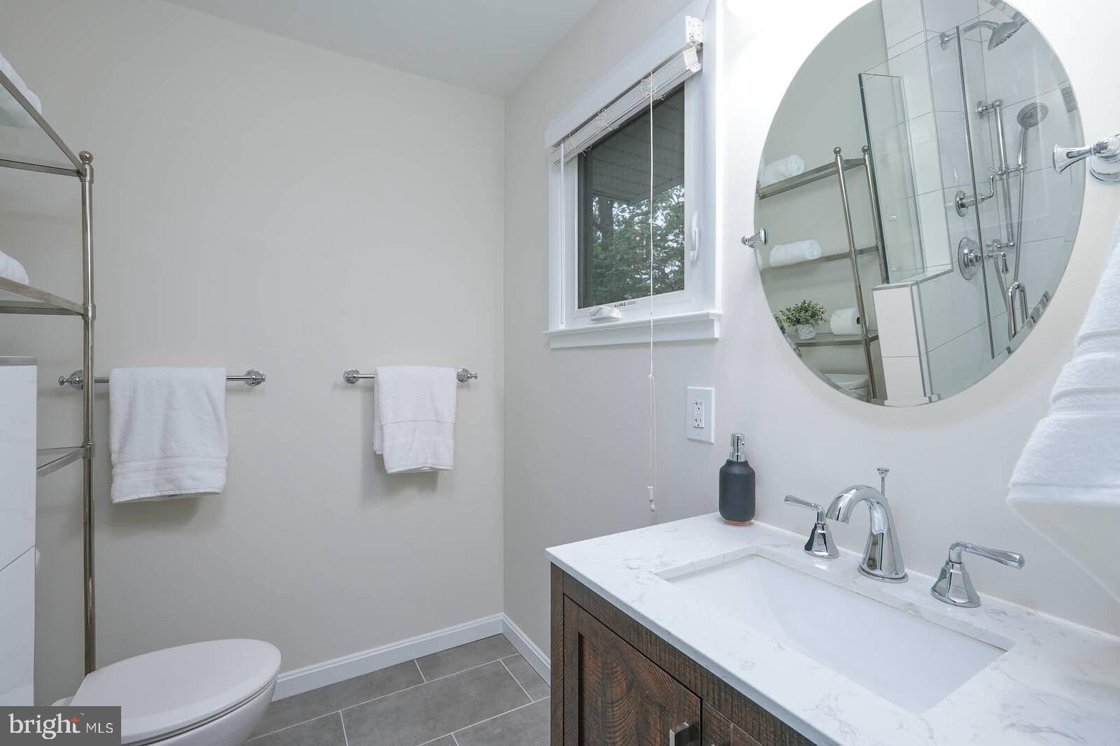 6511 Engel Drive McLean, VA 22101 - Photo 23 of 56 a bathroom with a sink vanity granite and toilet