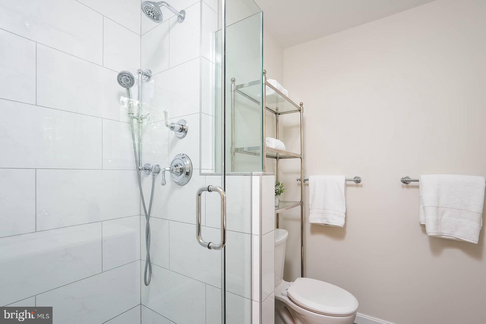 6511 Engel Drive McLean, VA 22101 - Photo 25 of 56 a bathroom with a toilet and shower