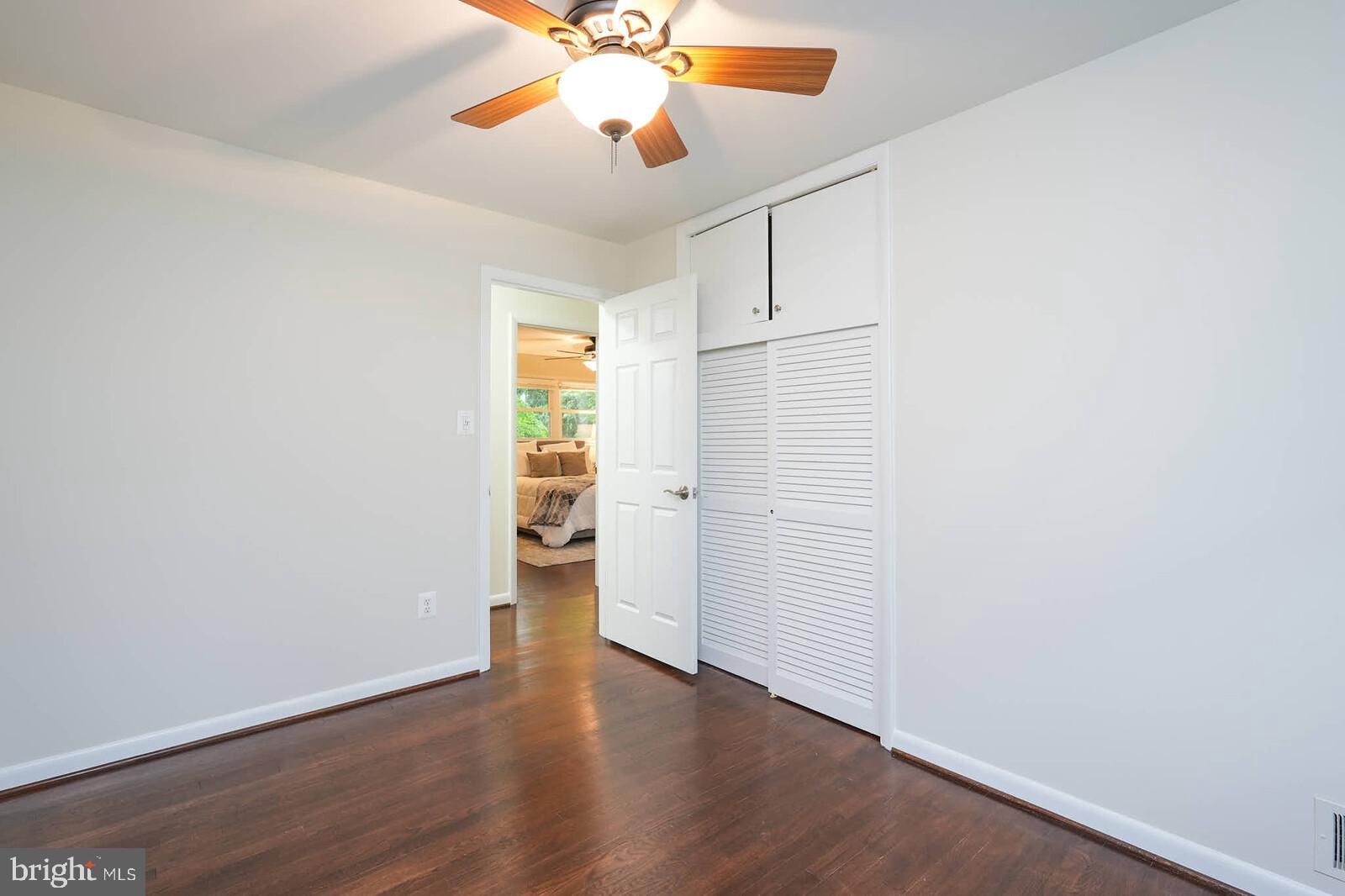 6511 Engel Drive McLean, VA 22101 - Photo 27 of 56 an empty room with wooden floor closet and windows