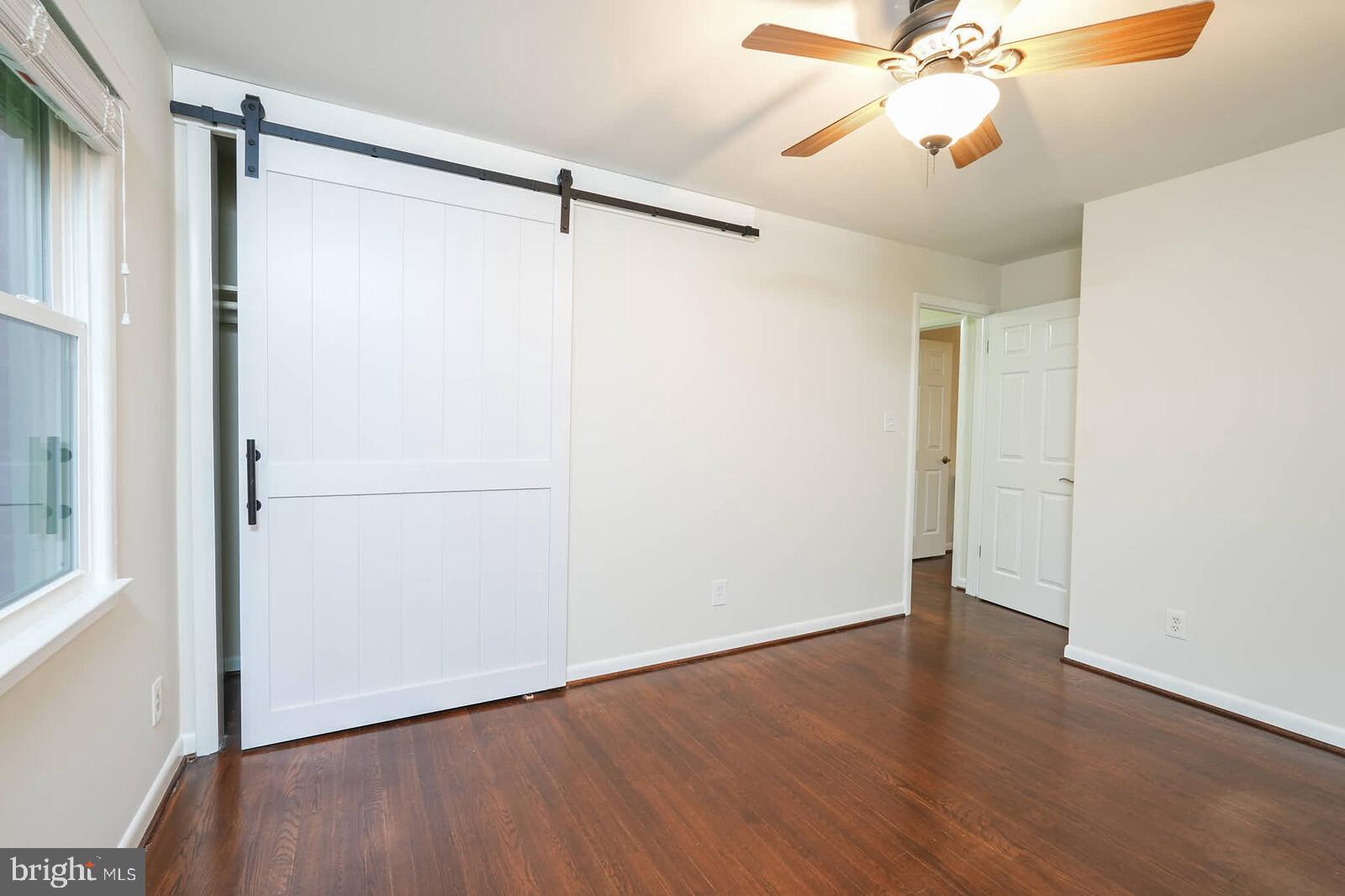 6511 Engel Drive McLean, VA 22101 - Photo 29 of 56 a view of an empty room with a window and wooden floor
