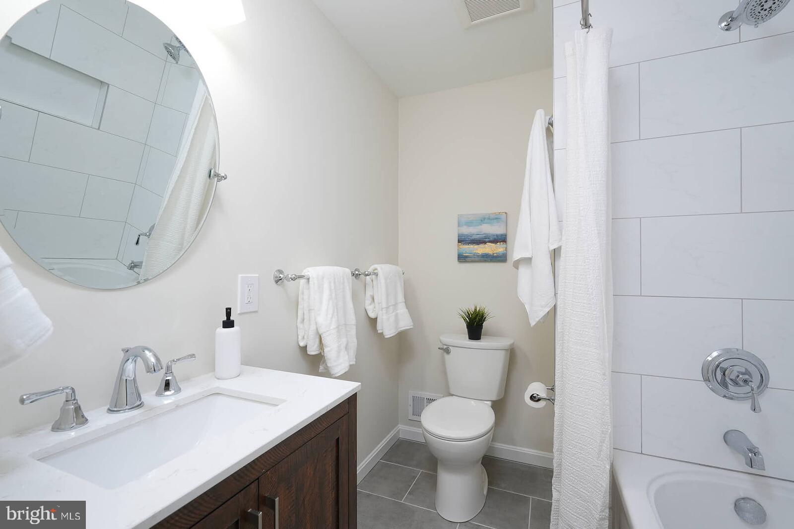 6511 Engel Drive McLean, VA 22101 - Photo 30 of 56 a bathroom with a sink toilet and shower
