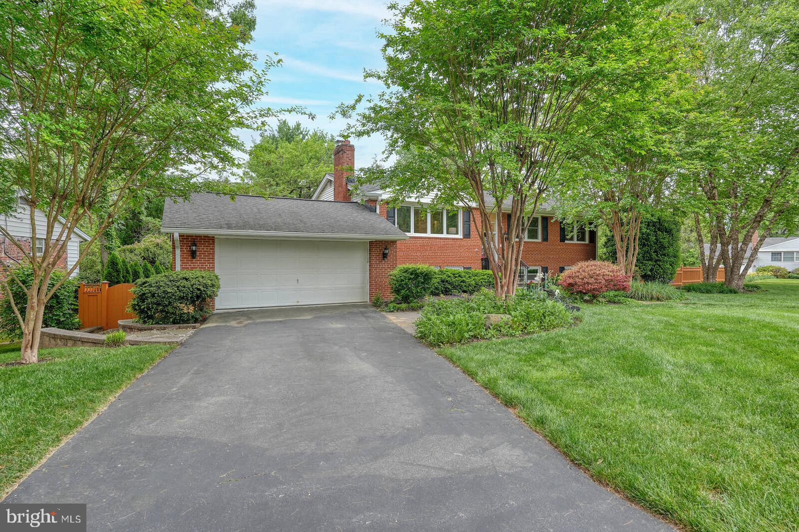 6511 Engel Drive McLean, VA 22101 - Photo 3 of 56 a front view of a house with garden