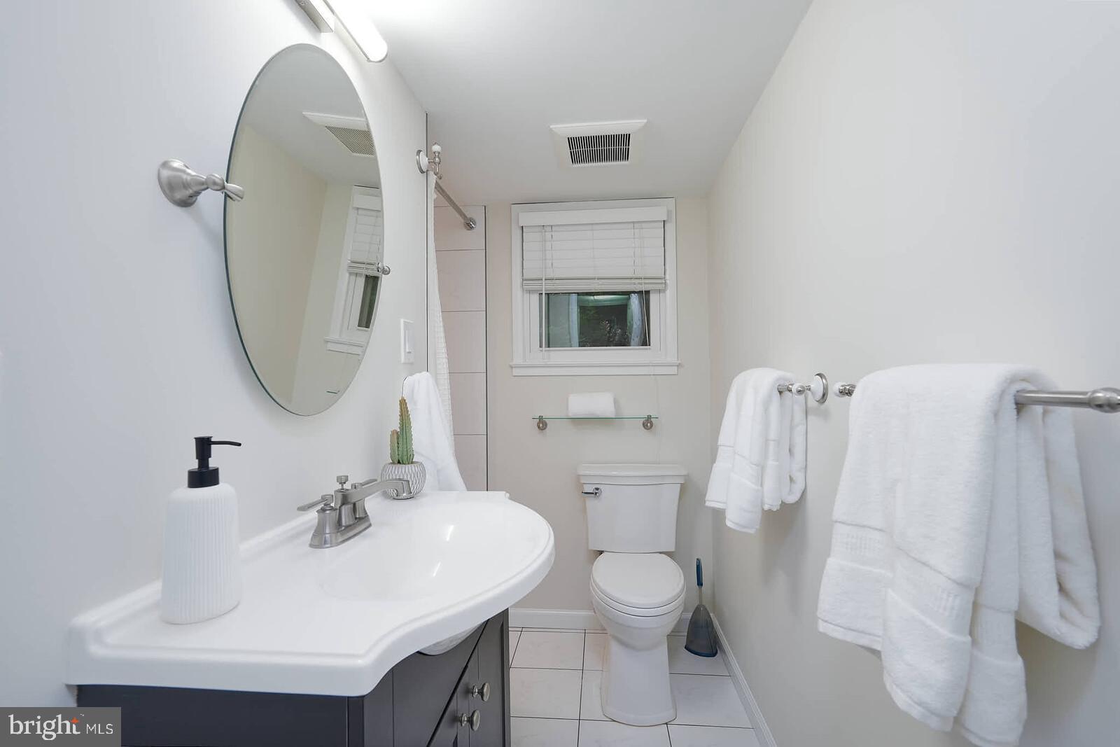 6511 Engel Drive McLean, VA 22101 - Photo 38 of 56 a bathroom with a sink toilet and shower