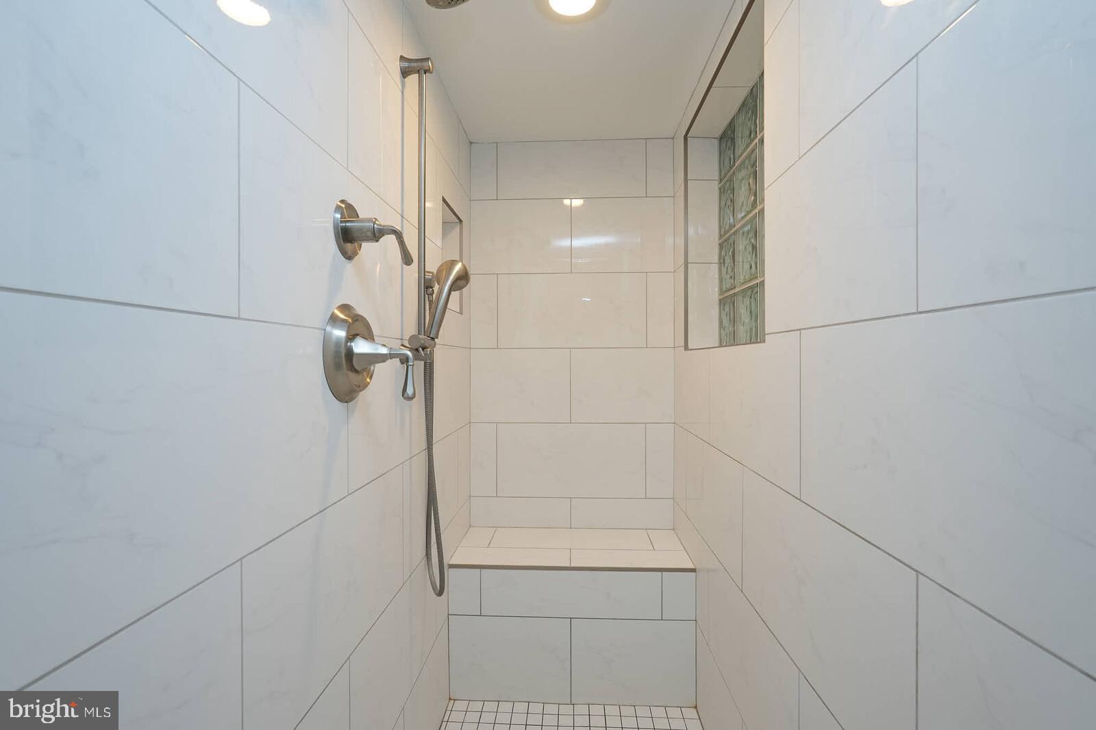 6511 Engel Drive McLean, VA 22101 - Photo 39 of 56 a bathroom with a shower