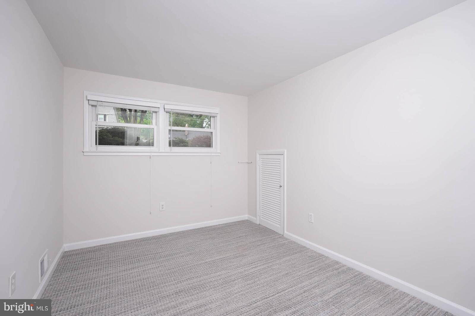6511 Engel Drive McLean, VA 22101 - Photo 40 of 56 a view of an empty room with wooden floor and a window