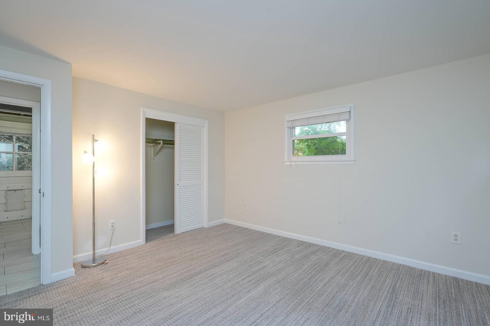 6511 Engel Drive McLean, VA 22101 - Photo 42 of 56 an empty room with wooden floor and windows