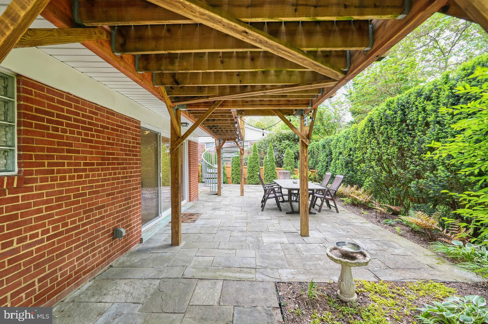 6511 Engel Drive McLean, VA 22101 - Photo 47 of 56 a view of patio with table and chairs and potted plants