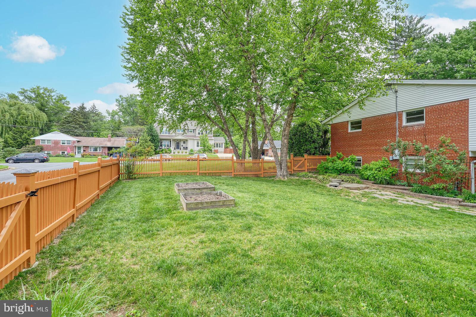 6511 Engel Drive McLean, VA 22101 - Photo 52 of 56 a view of a backyard with a garden and trees