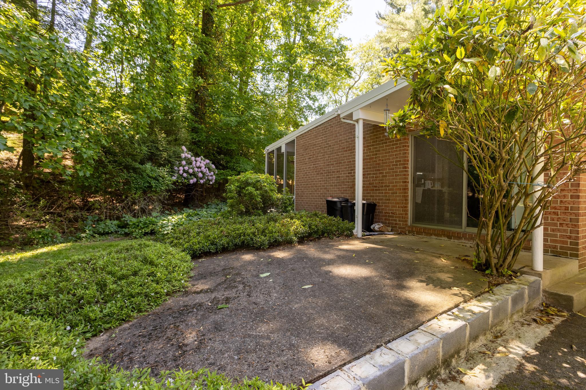 3207 Midfield Road Pikesville, MD 21208 - Photo 44 of 45 a backyard of a house with plants and large trees