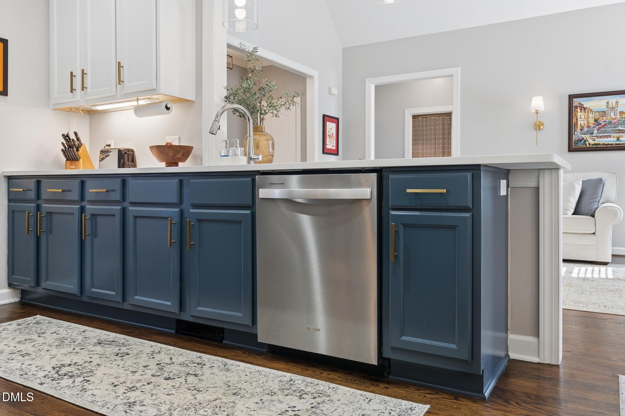 7340 Shady Stroll Lane Willow Spring, NC 27592 - Photo 14 of 67 a view of cabinets a oven a rug and wooden floor