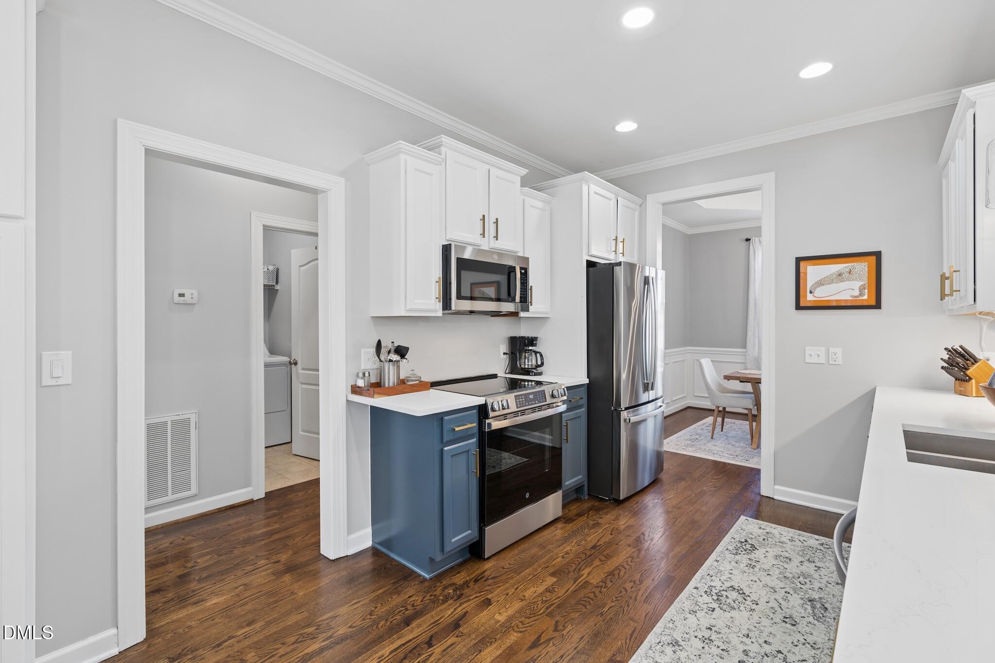7340 Shady Stroll Lane Willow Spring, NC 27592 - Photo 16 of 67 a kitchen with stainless steel appliances granite countertop a refrigerator stove and sink