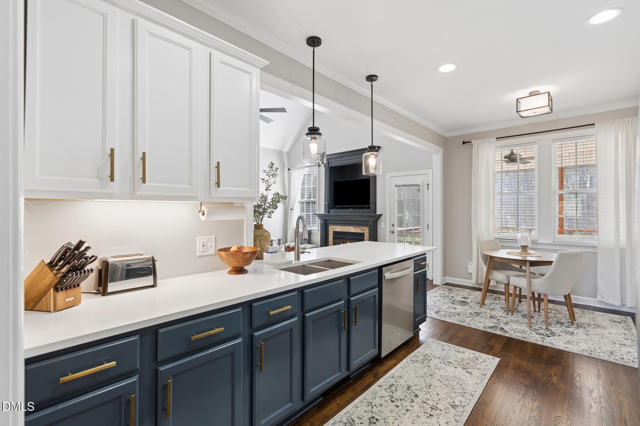 7340 Shady Stroll Lane Willow Spring, NC 27592 - Photo 18 of 67 a kitchen with stainless steel appliances granite countertop a sink a stove and a wooden floors