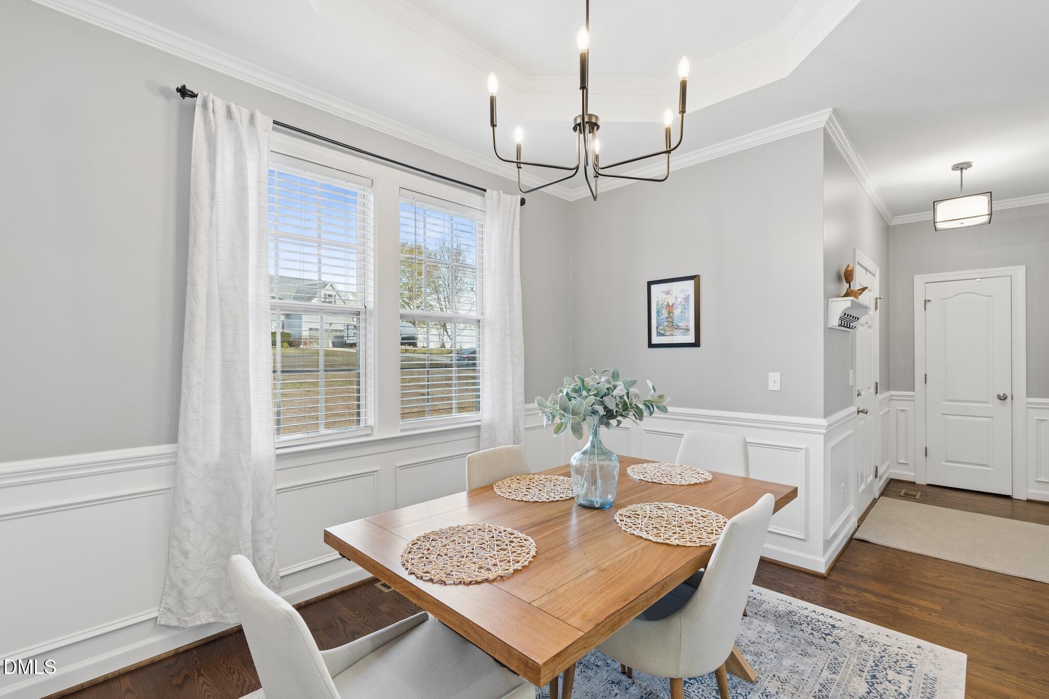 7340 Shady Stroll Lane Willow Spring, NC 27592 - Photo 20 of 67 a view of a dining room with furniture window and wooden floor