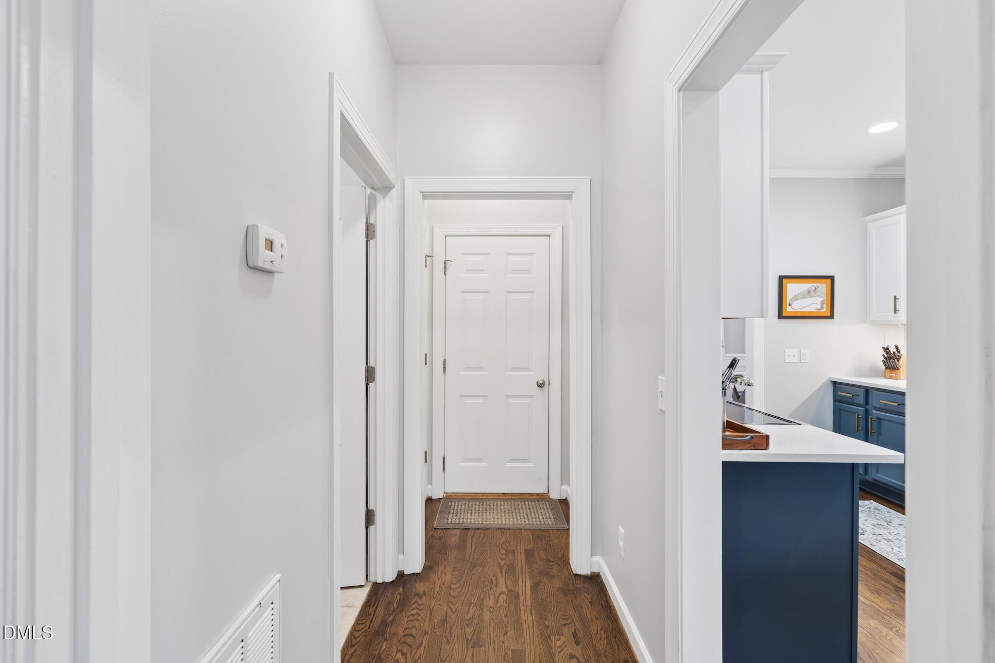 7340 Shady Stroll Lane Willow Spring, NC 27592 - Photo 23 of 67 a view of a hallway with a closet and wooden floor