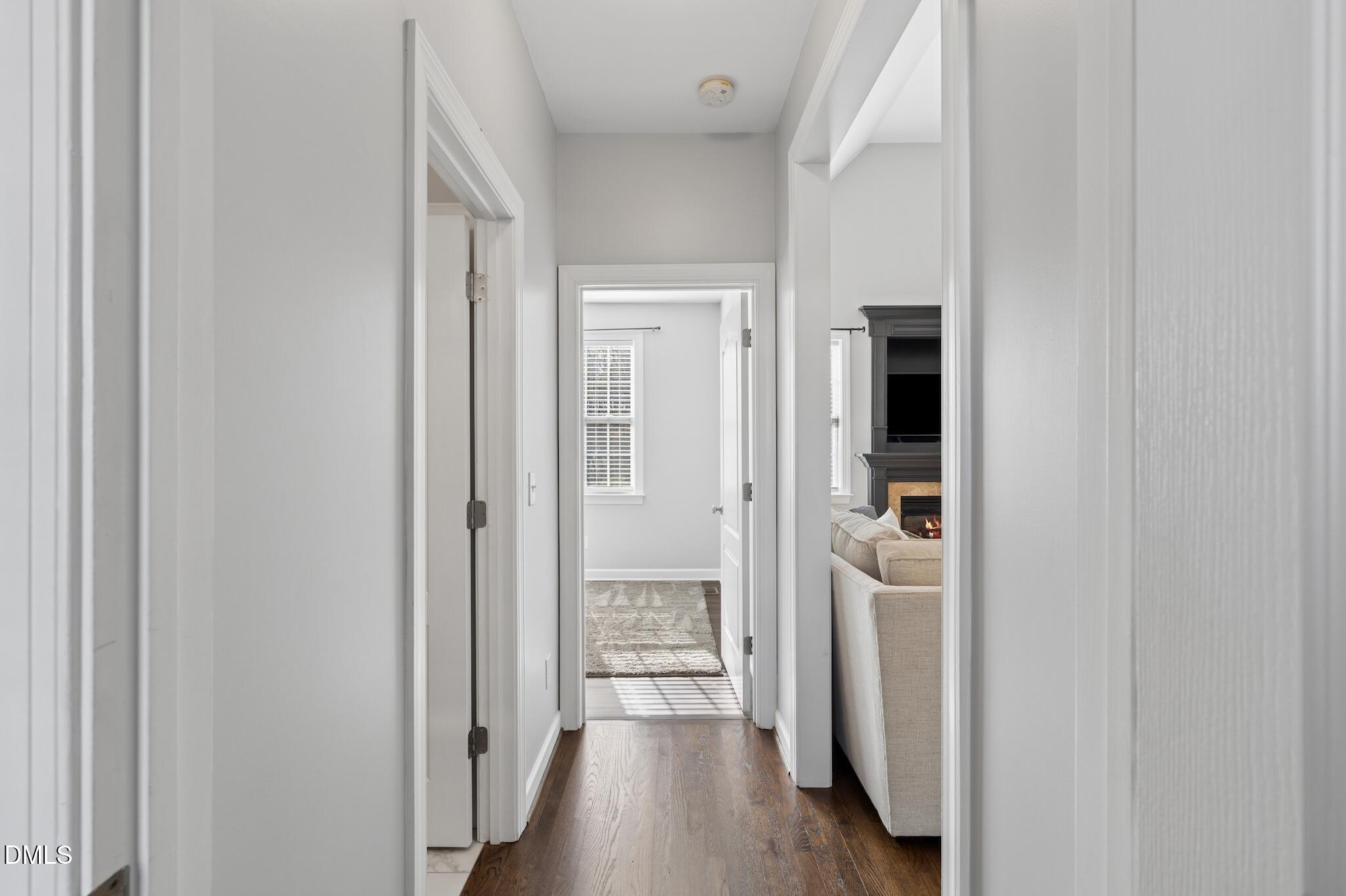 7340 Shady Stroll Lane Willow Spring, NC 27592 - Photo 37 of 67 a view of a hallway with wooden floor and closet