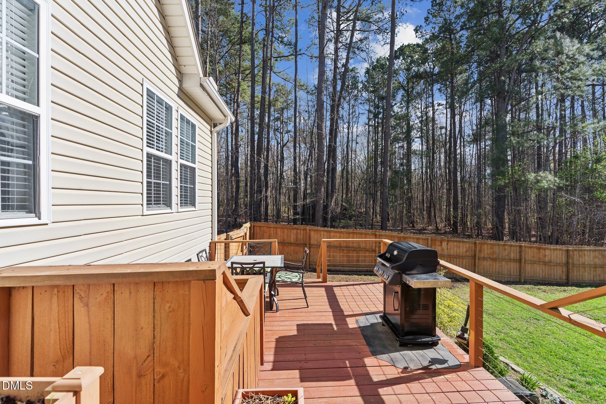 7340 Shady Stroll Lane Willow Spring, NC 27592 - Photo 48 of 67 a view of a chairs and tables in the back yard of a house