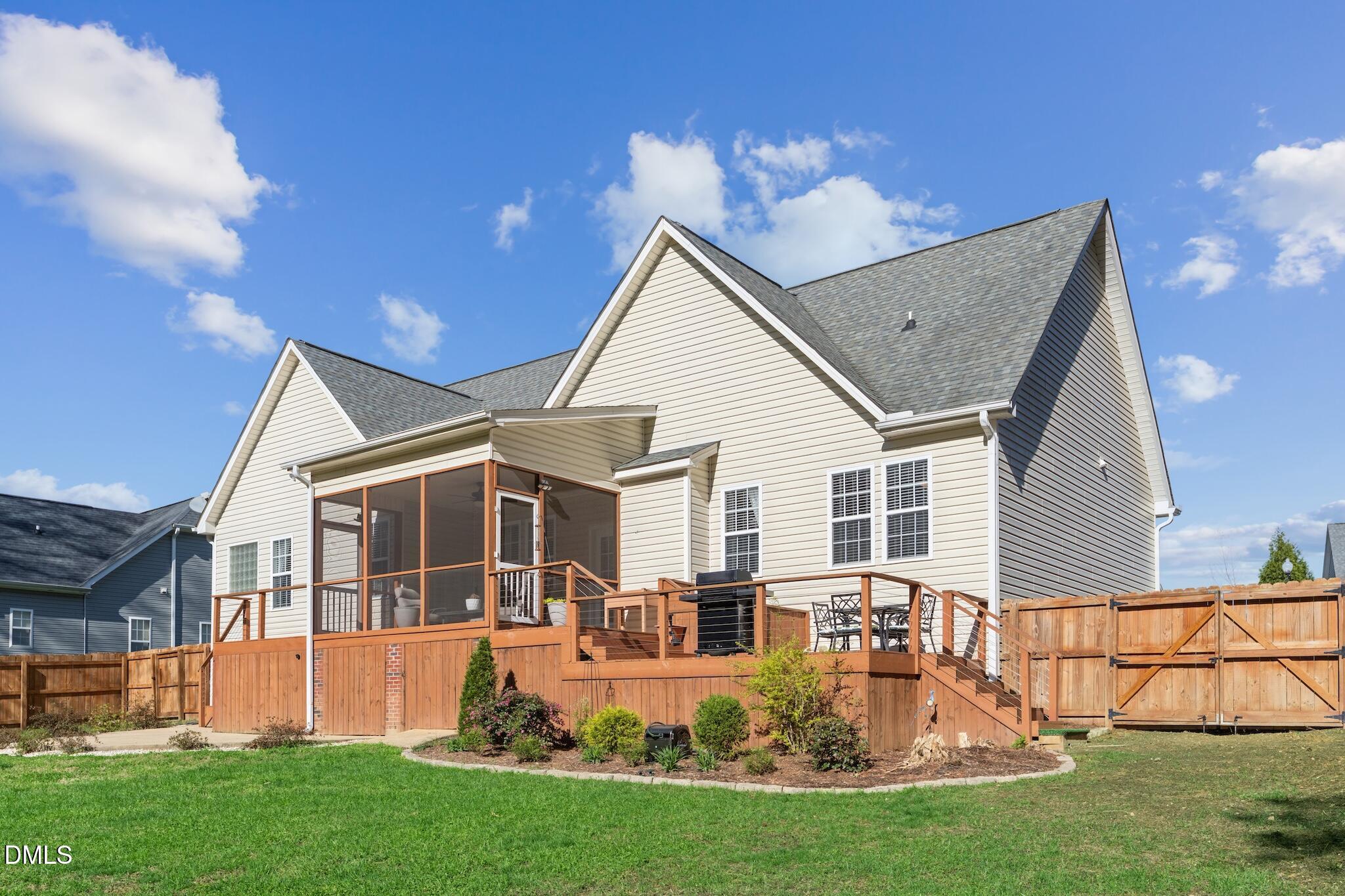 7340 Shady Stroll Lane Willow Spring, NC 27592 - Photo 53 of 67 a front view of house with yard porch and green space