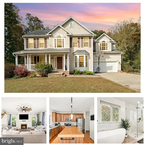 a view of houses with yard and green space