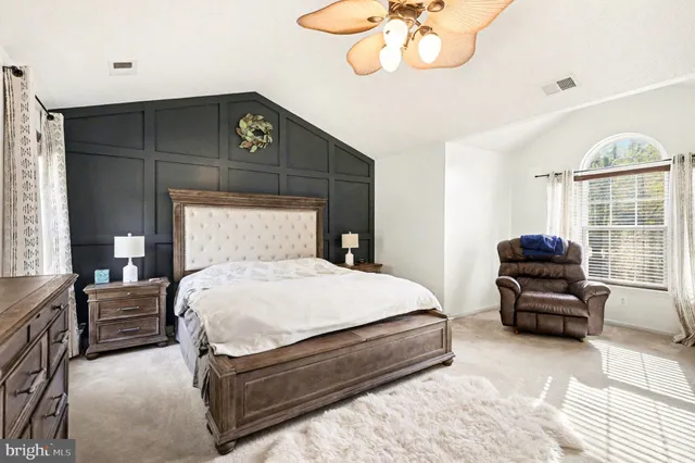 a bedroom with bed and window