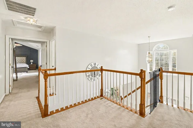 a view of a hallway with staircase