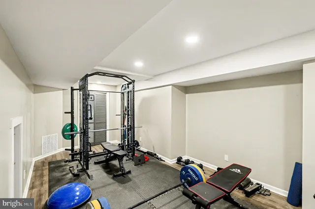 a room with gym equipment and a large window