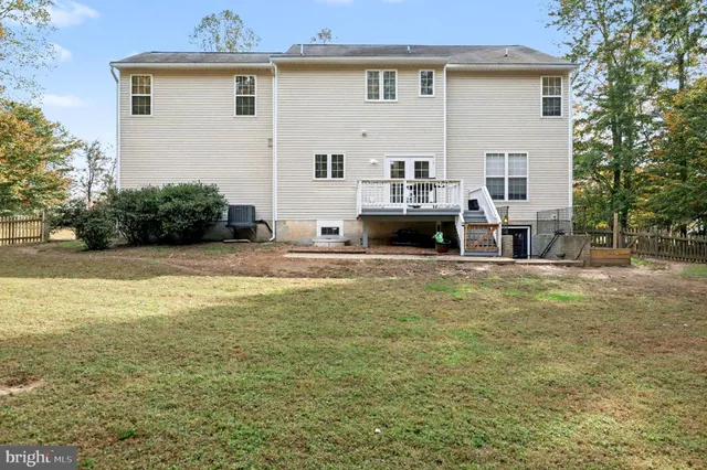 a view of house with outdoor space and swimming pool