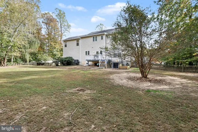 a view of a tree in front of a house