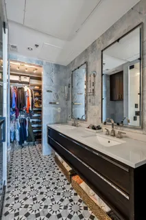 a living room with furniture a rug and a window