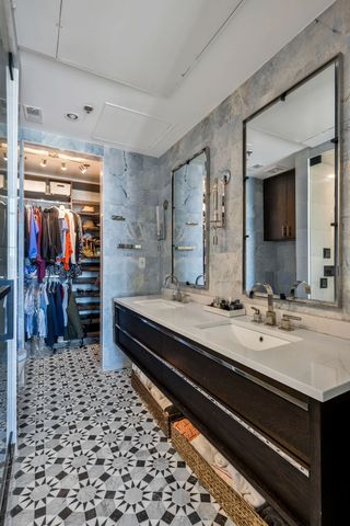 a living room with furniture a rug and a window