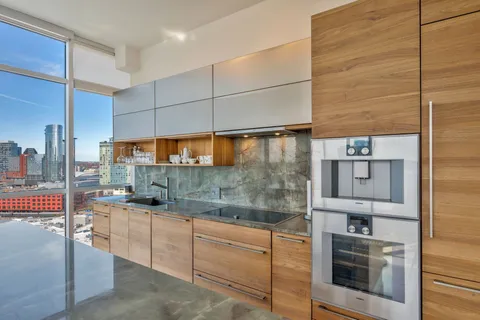 a kitchen with a sink and cabinets