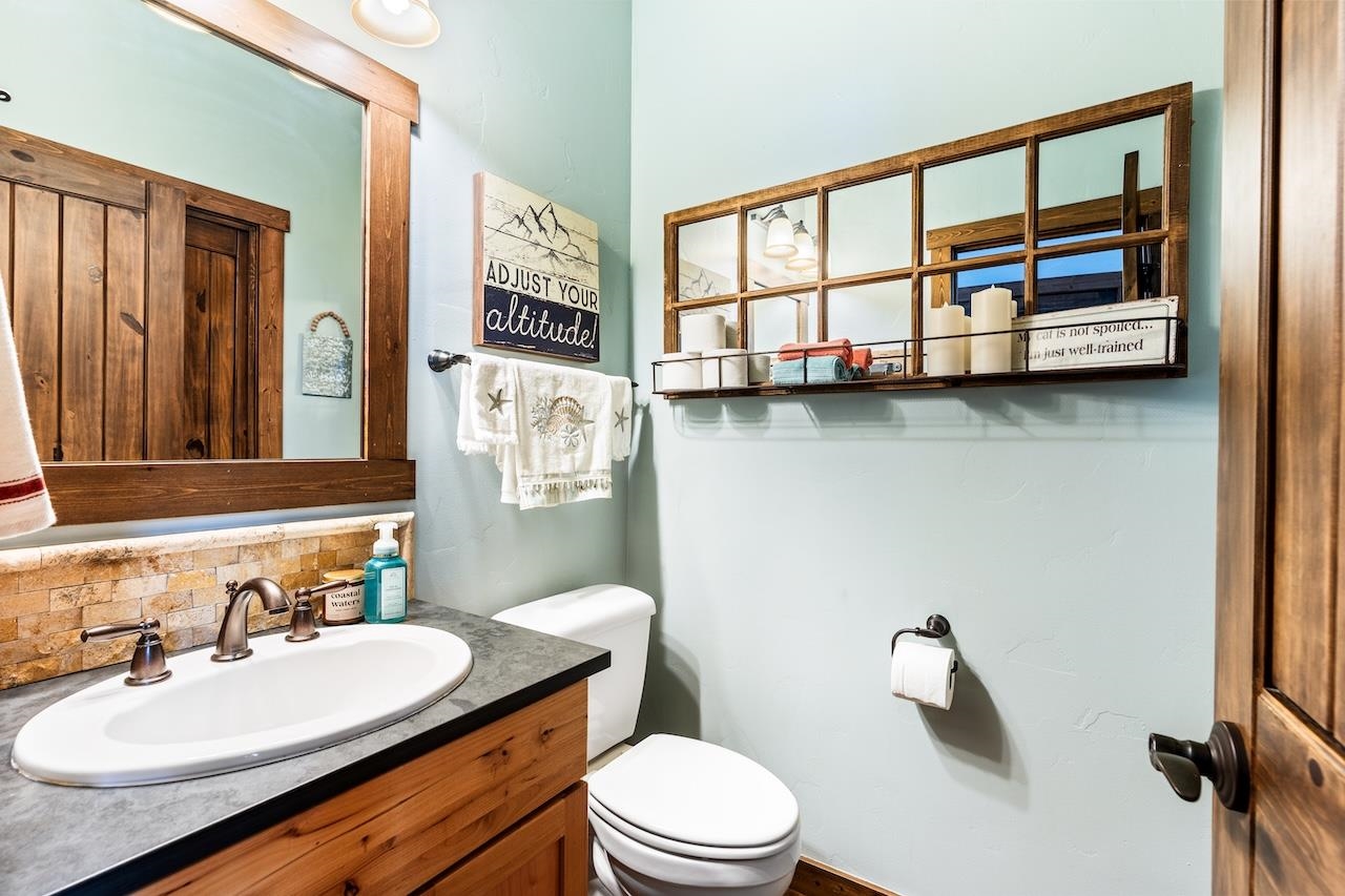 12719 Northwoods Boulevard Truckee, CA 96161 - Photo 22 of 28 a bathroom with a sink a toilet and a mirror