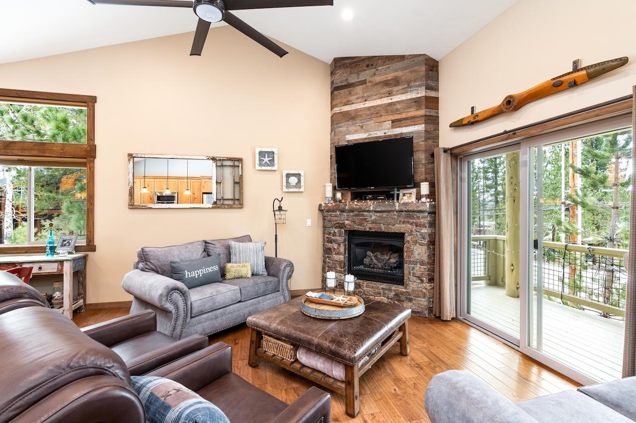 12719 Northwoods Boulevard Truckee, CA 96161 - Photo 7 of 28 a living room with furniture a flat screen tv and a fireplace