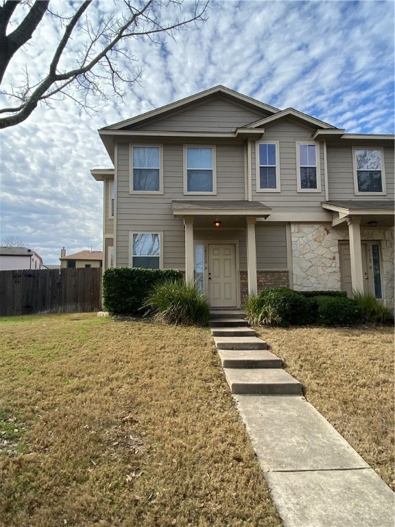 14112 Harris Ridge Boulevard, Unit A Pflugerville, TX 78660 - Photo 1 of 1 a front view of a house with a yard