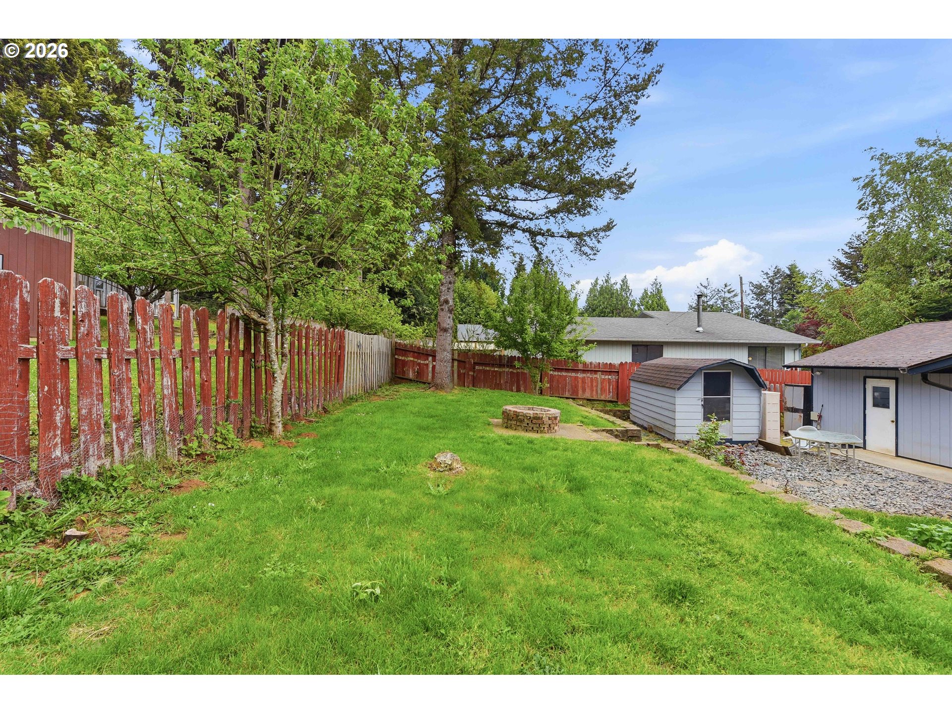 192 North Wood Ridge Road Coquille, OR 97423 - Photo 36 of 42 a view of backyard of house with green space