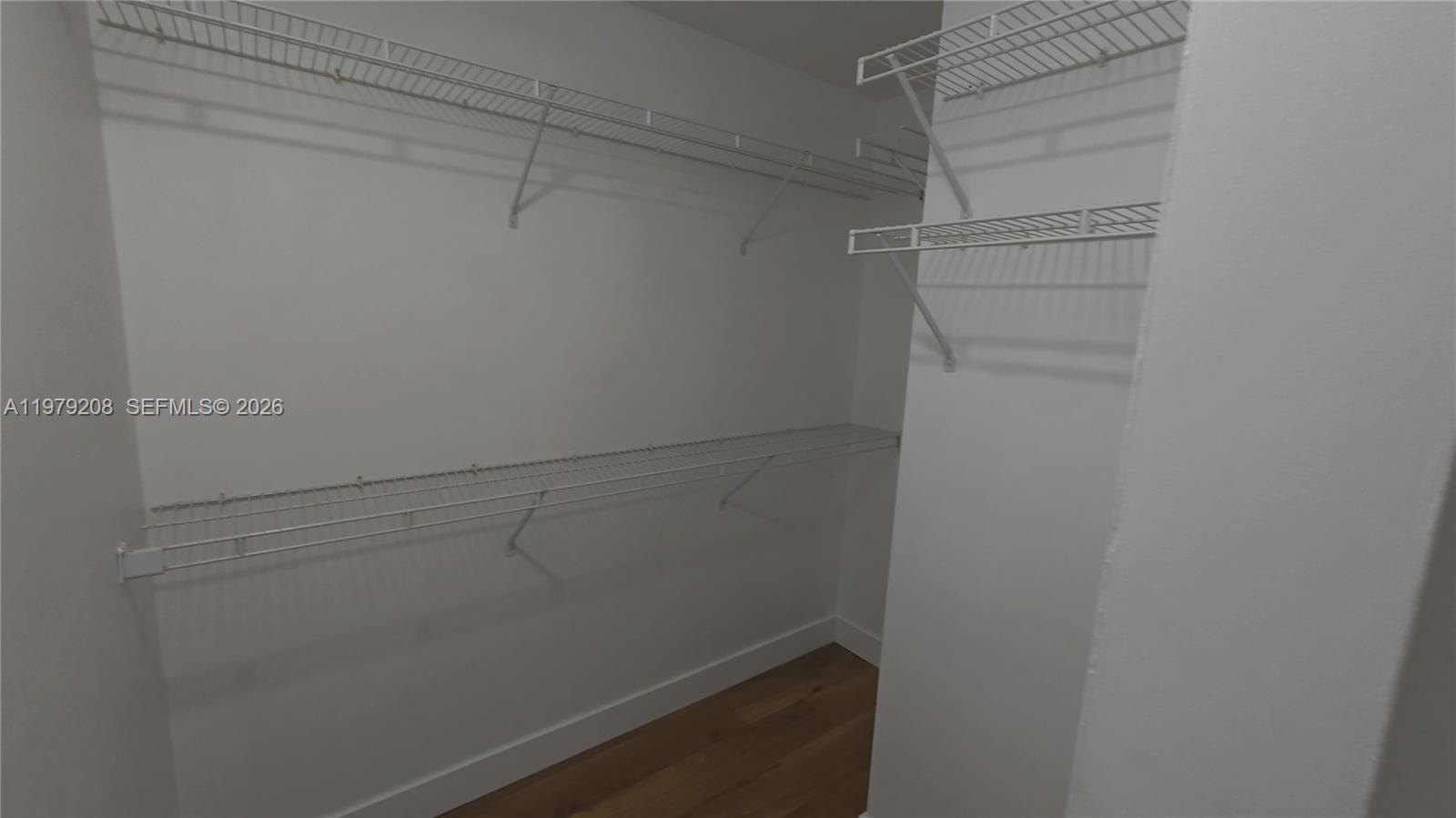7121 Southwest 129th Avenue, Unit 8 Miami, FL 33183 - Photo 10 of 13 a view of a room with racks on the wall