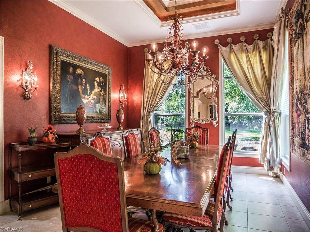 136 Hickory Road Naples, FL 34108 - Photo 12 of 34 Formal dining room with views of the backyard.