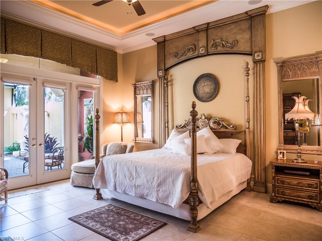 136 Hickory Road Naples, FL 34108 - Photo 17 of 34 Elegant master bedroom that is spacious and offers views and privacy to the lanai.