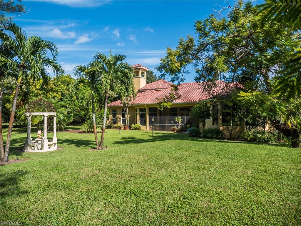 136 Hickory Road Naples, FL 34108 - Photo 5 of 34 Rear view of home.