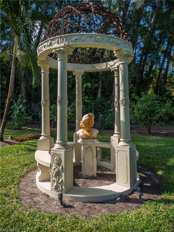 136 Hickory Road Naples, FL 34108 - Photo 6 of 34 Backyard art.