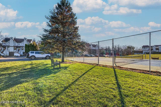 a view of a swimming pool with an outdoor seating
