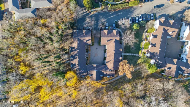 a view of a house with a tree and a yard