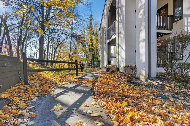 a view of a street with houses a street and trees