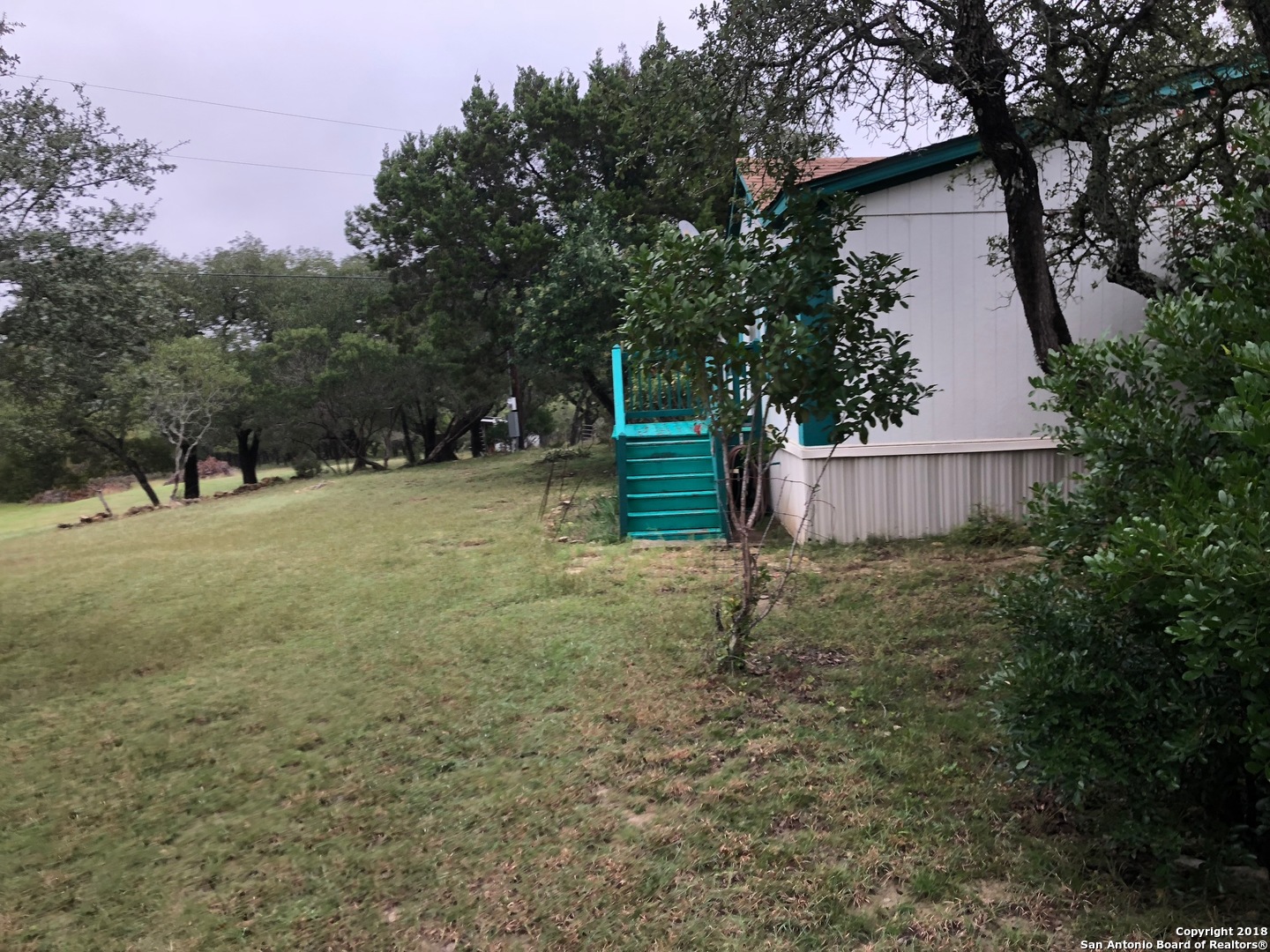 403 Los Indios Road Boerne, TX 78006 - Photo 4 of 21 a backyard of a house