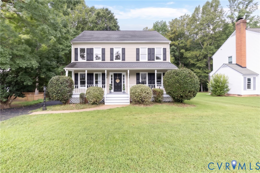 Two-story residence with a covered front porch, da