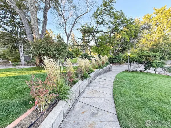 a view of a backyard with wooden floor and fence