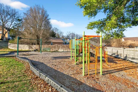 an aerial view of a house with swimming pool and mountain view