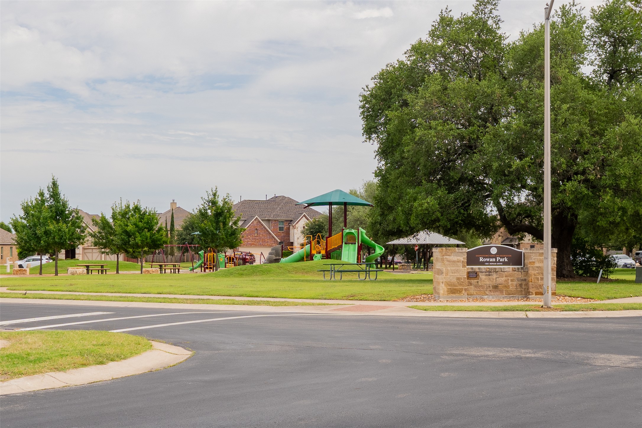 403 Tascate Street Georgetown, TX 78628 - Photo 2 of 26 A well-maintained community park offers recreation with playground equipment and picnic areas.