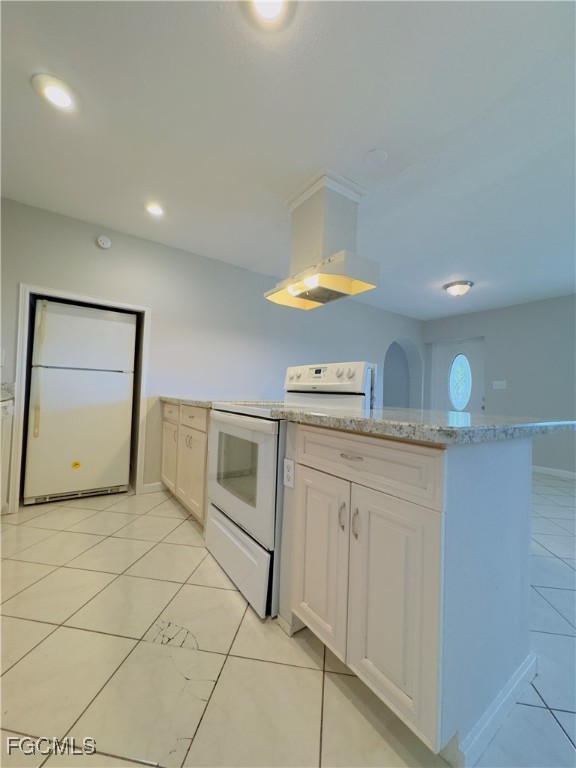 913 Hudson Avenue Lehigh Acres, FL 33936 - Photo 11 of 36 a kitchen with stainless steel appliances a sink and a stove