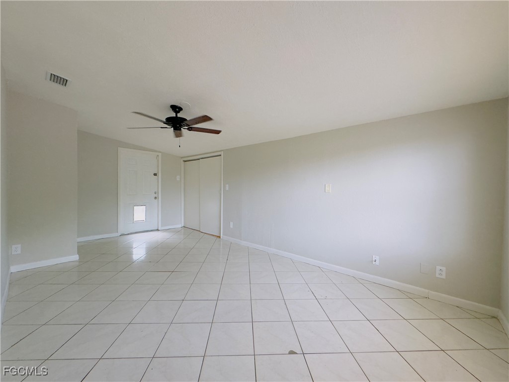 913 Hudson Avenue Lehigh Acres, FL 33936 - Photo 16 of 36 a view of an empty room and chandelier fan