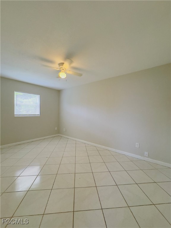913 Hudson Avenue Lehigh Acres, FL 33936 - Photo 21 of 36 a view of an empty room and chandelier fan